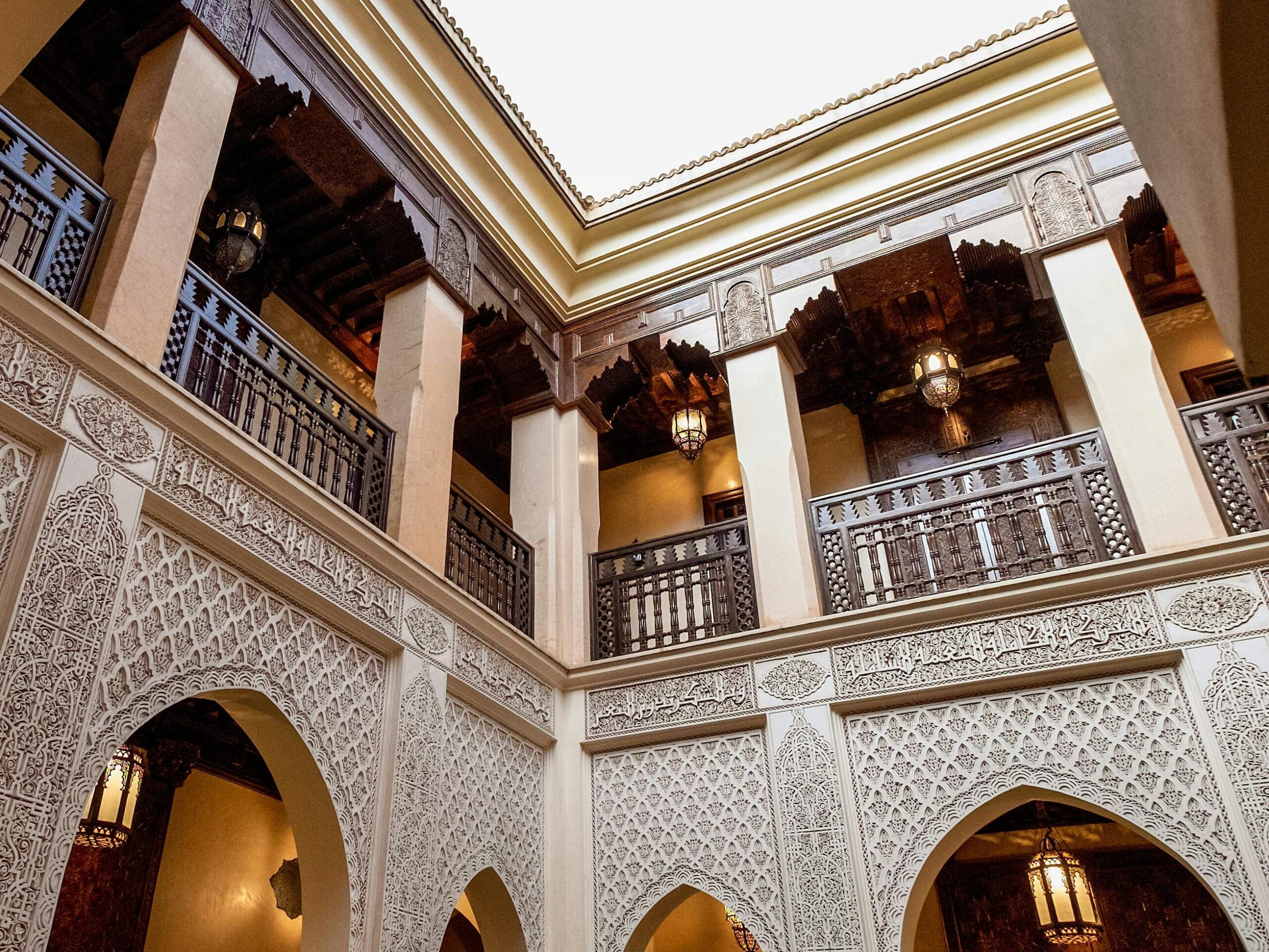 Beautiful interior courtyard of a traditional Moroccan riad in Marrakesh showcasing intricate design.